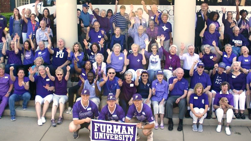 People outside cheering for Furman